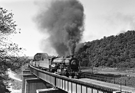 Western Maryland Railway 2-10-0 steam locomotive no. 1121 pulls an eastbound freight train over the Baltimore & Ohio Railroad at Meyersdale, Pennsylvania, circa 1948. Furler-22-090-02; © 2017, Center for Railroad Photography and Art