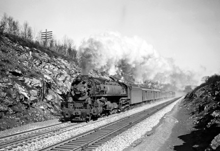 Delaware, Lackawanna and Western Railroad 4-8-4 steam locomotive no. 1633 leads eastbound passenger train no. 26 near Lake Lackawanna, New Jersey on May 10, 1947. Photograph by Donald Furler.  Furler-11-118-01.JPG; © 2017, Center for Railroad Photography and Art