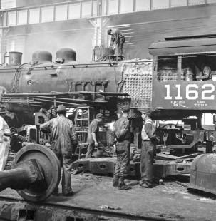 National Railways of Mexico roundhouse workers are working on steam locomotive no. 1162 engine and parts at Aguascalientes, Mexico on September 11, 1961, Rose-01-068-07; Photograph by Ted Rose, © 2015, Center for Railroad Photography and Art
