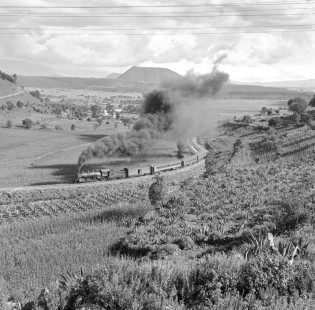 National Railways of Mexico steam locomotive no. 2117 leads passenger train on the Acambaro-Toluca-Mexico City line, likely near Toluca, Mexico, circa 1960. Rose-01-056-01; Photograph by Ted Rose,  © 2015, Center for Railroad Photography and Art