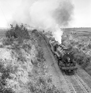 National Railways of Mexico 2-8-2 steam locomotive no. 2123 leads an eastbound freight train near Apizaco, Tlaxcala, Mexico. It is late afternoon on August 25, 1961.  Rose-01-091-11; Photograph by Ted Rose, © 2015, Center for Railroad Photography and Art