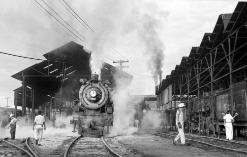 National Railways of Mexico steam locomotive no. 1551 with workers at Tierra Blanca roundhouse and stalls in state of Veracruz, Mexico on August 29, 1961.  Center for Railroad Photography and Art; Rose-01-189-09; Photograph by Ted Rose, © 2015, Center for Railroad Photography and Art