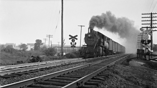 Reading Company 2-8-0 steam locomotive no. 1528 pulling a short freight train through a crossing at Allentown, Pennsylvania, circa 1935. Photograph by Donald W. Furler, © 2017, Center for Railroad Photography and Art, Furler-24-090-02