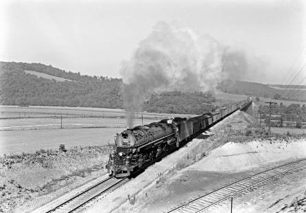 Western Maryland Railway 4-6-6-4 steam locomotive no. 1208 leads an eastbound freight train at Meyersdale, Pennsylvania, circa 1952. The rear of the train is crossing the Salisbury Viaduct, which spans the Casselman River and the Baltimore & Ohio Railroad's main line. Furler-16-006-01; © 2017, Center for Railroad Photography and Art