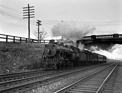 Delaware, Lackawanna and Western Railroad 4-6-0 steam locomotive no. 1010 leads westbound passenger train near Towaco, New Jersey, in 1940. Photograph by Donald Furler; Furler-03-012-03.JPG; © 2017, Center for Railroad Photography and Art