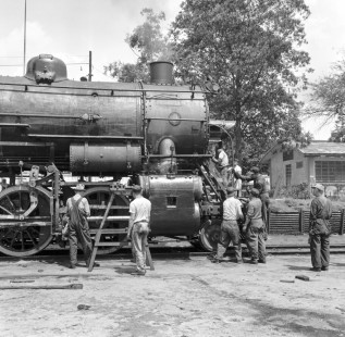 Workers attend NdeM steam locomotive no. 1586  in yard at Aguascalientes, State of Aguscalientes, Mexico, circa 1960. Rose-01-057-04; Photograph by Ted Rose,  © 2015, Center for Railroad Photography and Art