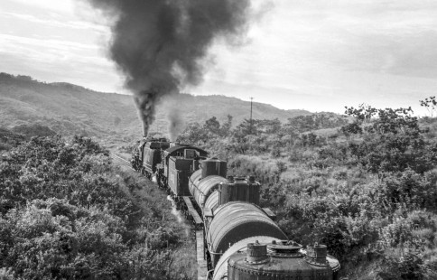 A National Railways of Mexico doubleheader led by 2-8-0 steam locomotives nos. 1395 and 1127 works upgrade south of Matias Romero, Oaxaca toward Ixtepec on September 2, 1961. Rose-01-207-06; Photograph by Ted Rose, © 2015, Center for Railroad Photography and Art