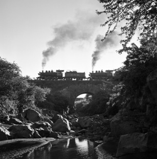 National Railways of Mexico 2-8-0 steam locomotive nos. 263 and 276 cross bridge near narrow gauge terminal near Cuautla, Morelos, Mexico on August 25, 1961. Rose-01-001-08; Photograph by Ted Rose, © 2015, Center for Railroad Photography and Art