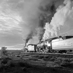 National Railways of Mexico 2-8-2 steam locomotive nos. 2209 (helper) and 2203 (road) lead southbound freight as they climb the grade up to Zacatecas, State of Zacatecas, Mexico on August 17, 1961. Both engines are former Nickel Plate Road locomotives. Rose-01-055-05; Photograph by Ted Rose,  © 2015, Center for Railroad Photography and Art