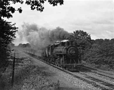 Erie Railroad 4-6-2 steam locomotive no. 2518 leading westbound passenger train no. 701 south of Ferndale Avenue on the Main Line between Glen Rock and Hawthorne, New Jersey, in 1945. Photograph by Donald W. Furler, © 2017, Center for Railroad Photography and Art, Furler-03-026-03