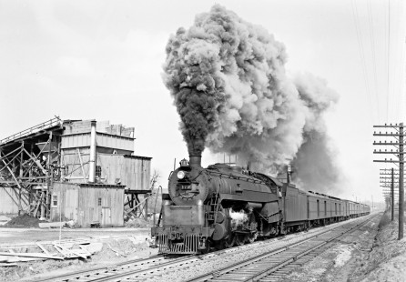 Reading Company 4-6-2 steam locomotive no. 179 pulling a westbound passenger train in Allentown, Pennsylvania near what is now Downyflake Lane, circa 1950. Sheesley Redi-Mix Concrete plant is visible on the left side of the image. Photograph by Donald W. Furler, © 2017, Center for Railroad Photography and Art, Furler-19-004-02