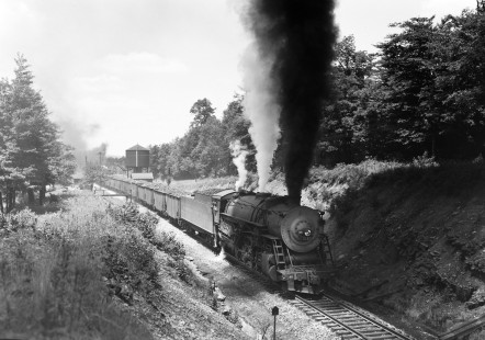 An eastbound Western Maryland Railway freight train led by 2-10-0 steam locomotive no. 1120 on the Connellsville subdivision at Deal, Pennsylvania. This was the Western Maryland's summit over the Allegheny Mountains on the Eastern Continental Divide at an elevation 2,375 ft.  It is 17 miles downhill from there on the WM route to Cumberland, Maryland. Photograph by Donald W. Furler. Furler-22-089-01. © 2017, Center for Railroad Photography and Art
