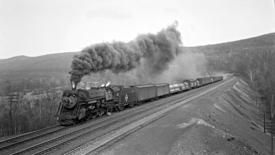 Erie Railroad 4-6-2 steam locomotive no. 2932 with westbound passenger train no. 9 approaching Black Rock near Port Jervis, New York, on April 23, 1948. Photograph by Donald W. Furler, © 2017, Center for Railroad Photography and Art, Furler-09-112-01