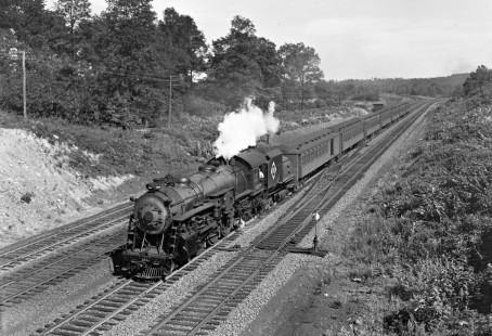 Erie Railroad 4-6-2 steam locomotive no. 2509 with westbound passenger train no. 255 at Howells, New York, where the Erie's Graham Line meets the original Main Line on August 5, 1945.  No. 2509 was the sole locomotive in Class K-3 and the 50,000th produced by ALCO. Photograph by Donald W. Furler, © 2017, Center for Railroad Photography and Art, Furler-10-094-01