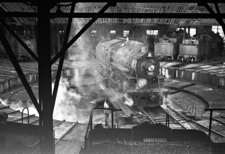 National Railways of Mexico 2-8-0 steam locomotive no. 1180 being turned on a turntable at Acambaro, Guanajuto, Mexico. Rose shot the image from the cab roof of 2-8-0 no. 1247 on August 29, 1960. Rose-01-204-07; Photograph by Ted Rose, © 2015, Center for Railroad Photography and Art