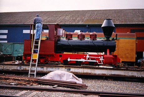 A worker conducts restoration work on a steam locomotive at the National Railway Museum at Port Adelaide, South Australia, Australia, on April 14, 2003. Photograph by Fred M. Springer, © 2014, Center for Railroad Photography and Art. Springer-Australia-NZ(2)-04-14