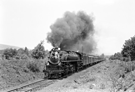 Delaware, Lackawanna, and Western Railroad 4-8-4 steam locomotive no. 1641 leads westbound excursion running on Lehigh and New England Railroad tracks east of Pen Argyl, Pennsylvania on May 15, 1949. Furler-11-118-02.JPG; © 2017, Center for Railroad Photography and Art