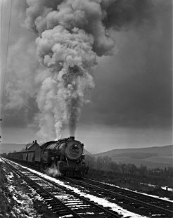 Reading Company 2-8-2 steam locomotive no. 1730 pulling a 58-car eastbound coal train with two additional locomotives pushing at McCauley, Pennsylvania, on November 17, 1940. This was the second of three eastbound trains that ran in close succession every Sunday afternoon on the Catawissa Branch. Photograph by Donald W. Furler,  © 2017, Center for Railroad Photography and Art, Furler-03-109-04