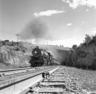 National Railways of Mexico steam locomotive no. 3025 hauls freight through tunnel approximately 15 miles north of Terminal del Valle de Mexico at Tlalnepantla de Baz, Mexico, Mexico, in August or September of 1961. The train carries oil to fire the kilns of the cement plant at Tula de Allende, Hidalgo, Mexico. Rose-01-064-09; Photograph by Ted Rose, © 2015, Center for Railroad Photography and Art
