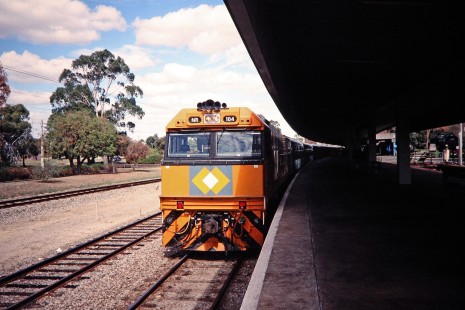 National Rail locomotive no. 104 leads the "Indian Pacific" passenger train at Perth, Western Australia, Australia, on April 14, 1998. At the time, Great Southern Rail was contracting NR to haul its services.   © 2014, Center for Railroad Photography and Art. Springer-Australia-16-29
