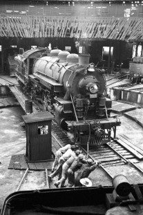 Workers move National Railways of Mexico steam locomotive no. 2518 out of engine house at Acambaro, Guanajuato, Mexico on August 30, 1960. Image shot from tender of nearby locomotive. Rose-01-125-04; Photograph by Ted Rose, © 2015, Center for Railroad Photography and Art