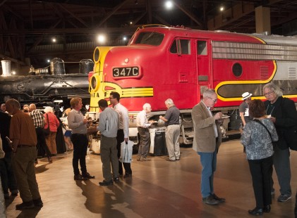 Attendees of the Center's <a href="http://www.railphoto-art.org/conferences/conversations-west-2018/" rel="nofollow">Conversations West</a> conference enjoy the closing reception in the roundhouse at the California State Railroad Museum. Photograph for the Center for Railroad Photography & Art by Henry A. Koshollek