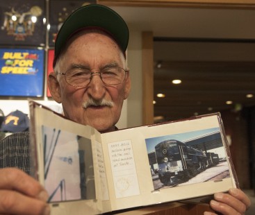 John Cockrell, retired Southern Pacific engineer, attended the exhibition opening on Friday evening. An author and historian, he shows a photograph of cab-forward locomotive no. 4294, now on display at the museum; see more on his website, <a href="http://www.45yearsrr.com" rel="nofollow">www.45yearsrr.com</a>. Photograph for the Center for Railroad Photography & Art by Henry A. Koshollek