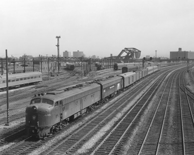 Penn Central diesel locomotive no. 4288, still wearing paint of predecessor Pennsylvania Railroad, with westbound  passenger train no. 55 in Chicago, Illinois, on May 6, 1968. Photograph by Victor Hand. Hand-PRR-32-101