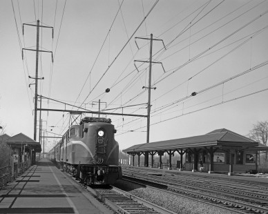 Pennsylvania Railroad GG1 electric locomotive no. 4937 with eastbound passenger train no. 170, the <i> Colonial</i>, in Princeton Junction, New Jersey, on March 25, 1967. Photograph by Victor Hand. Hand-PRR-32-082