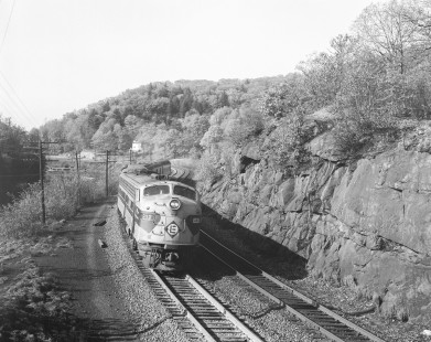 Erie Lackawanna Railroad locomotive no. 833 leads westbound passenger train no. 21 in Tuxedo, New York, on May 23, 1966; Photograph by Victor Hand. Hand-EL-30-105