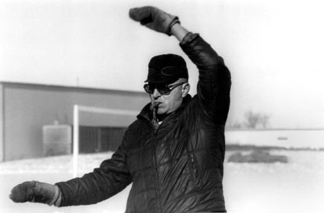 Herman Miller (1925-2004) of Mineral Point, Wisconsin, gives hand signals while switching freight cars west of Madison in 1978. Railroaders developed hand signals to communicate across long trains decades before radios were invented. Miller worked for the railroad for thirty-four years before retiring as a conductor in 1982.