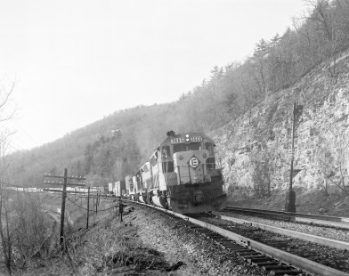 Erie Lackawanna Railway diesel locomotive no. 3666 leads freight train in Waverly, New York, on March 28, 1976; Photograph by Victor Hand; Hand-EL-30-191