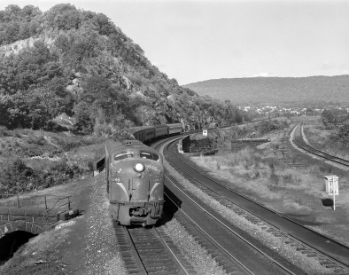Penn Central diesel locomotive no. 4246, still wearing paint of predecessor Pennsylvania Railroad, leads a passenger train in Marysville, Pennsylvania, on October 4, 1968. Photograph by Victor Hand. Hand-PRR-32-111.JPG