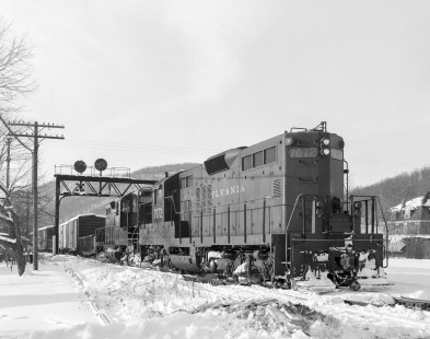 Pennsylvania Railroad diesel locomotive no. 7072 hauls  eastbound freight in Emporium, Pennsylvania, on January 24, 1966. Photograph by Victor Hand. Hand-PRR-32-063
