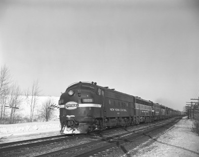 New York Central Railroad diesel locomotive no. 1809 leads  westbound freight in Churchville, New York, on December 31, 1963. Photograph by Victor Hand. Hand-NYC-PC-CR-31-0022
