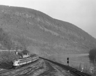Erie Lackawanna Railroad locomotive no. 832 leads eastbound passenger train no. 6, the "Lake Cities" at Slateford Junction, Pennsylvania, on November 27, 1967. The Delaware River is visible on the right side of the image. Photograph by Victor Hand; Hand-EL-30-137