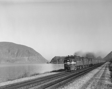 New York Central Railroad diesel locomotive no. 1098 leads a freight train eastward near Cold Spring, New York, on April 11, 1965. Photograph by Victor Hand. Hand-NYC-PC-CR-31-0029