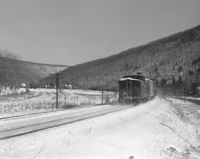 View of caboose of Pennsylvania Railroad freight train led by diesel locomotive no. 8492 in Cameron, Pennsylvania, on January 25, 1966. Photograph by Victor Hand. Hand-PRR-32-074
