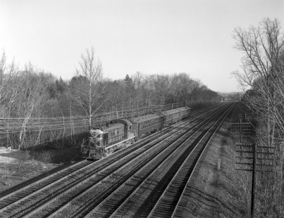 Erie Lackawanna Railroad locomotive no. 927, leads an empty equipment train at Ho-Ho-Kus, New Jersey on April 14,  1965. Photograph by Victor Hand. Hand-EL-30-037.JPG