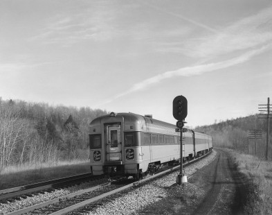 A view of observation car and back end of Erie Lackawanna Railroad passenger train no. 2, the "Phoebe Snow," in Factoryville, Pennsylvania, on November 15, 1966; Photograph by Victor Hand. Hand-EL-30-121