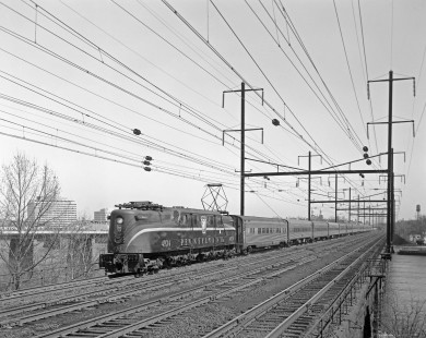 Pennsylvania Railroad GG1 electric locomotive no. 4834 crosses the Delaware River via the Morrisville-Trenton Railroad Bridge with southbound <i> Silver Star </i> in Morrisville, Pennsylvania, on March 25, 1967. Photograph by Victor Hand. Hand-PRR-32-084