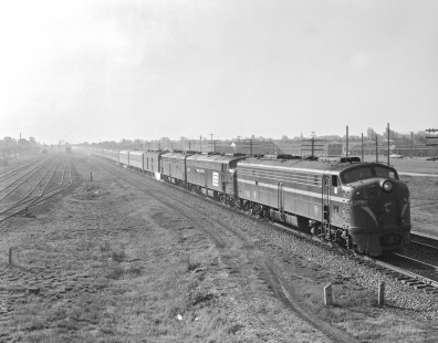 Penn Central diesel locomotive no. 4268, still wearing the paint of predecessor Pennsylvania Railroad, leads westbound  passenger train no. 49, the <i>Broadway Limited, </i> in Gary, Indiana, on May 4, 1968. Photograph by Victor Hand. Hand-PRR-32-096