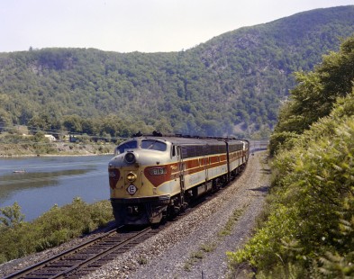 Erie Lackawanna Railroad locomotive no. 819 leads passenger train no 1, the "Phoebe Snow," at Delaware Water Gap, Pennsylvania on June 20, 1965. Photograph by Victor Hand. Hand-EL-C30-008