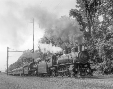 Pennsylvania Railroad steam locomotives nos. 7002 and 1223 leading an excursion train near Royalton, Pennsylvania, on August 23, 1985. Photograph by Victor Hand. Hand-NYC-PC-CR-31-0880