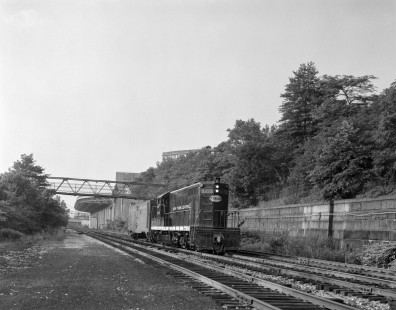 New York Central Railroad diesel locomotive no. 5775 leads  eastbound mail train no. 856 near 158th Street in New York City, New York, on June 20, 1965. Photograph by Victor Hand. Hand-NYC-PC-CR-31-0035