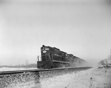 New York Central Railroad diesel locomotive no. 5934 leads  westbound passenger train no. 95, the "Dewitt Clinton," near Byron, New York, on December 29, 1963. Photograph by Victor Hand. Hand-NYC-PC-CR-31-0007