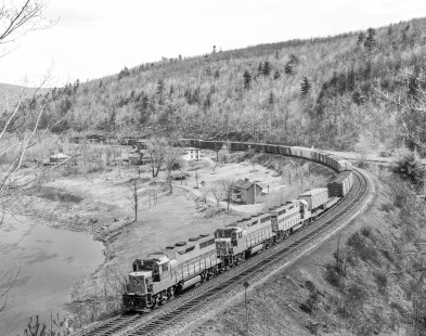 Erie Lackawanna Railroad locomotive no. 2565 leads a westbound freight train near Pond Eddy, Pennsylvania, on April 15, 1966.  Photograph by Victor Hand. Hand-EL-30-090