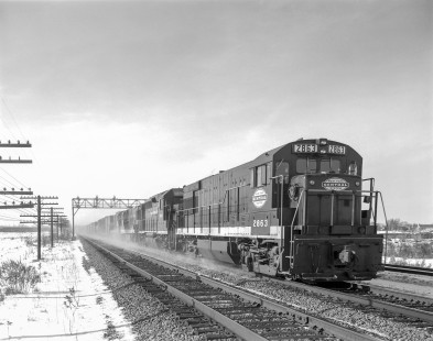 New York Central Railroad diesel locomotive no. 2863 hauls an eastbound freight train in Rochester, New York, on January 24, 1968. Photograph by Victor Hand. Hand-NYC-PC-CR-31-0117