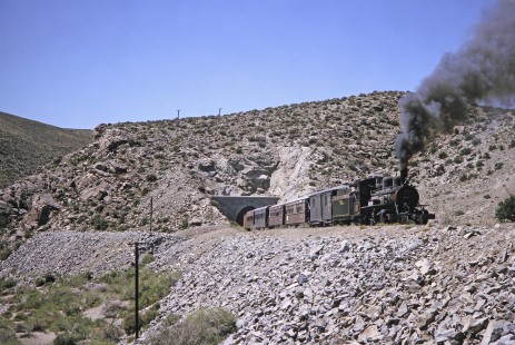 Viejo Expreso Patagónico (Old Patagonian Express) steam locomotive no. 19 leads passenger train through the Cerro Mesa tunnel in Cerro Mesa, Río Negro, Argentina, on October 29, 1995.  © 2014, Center for Railroad Photography and Art, Photograph by Fred M. Springer. Springer-CHI-ARG1-09-26