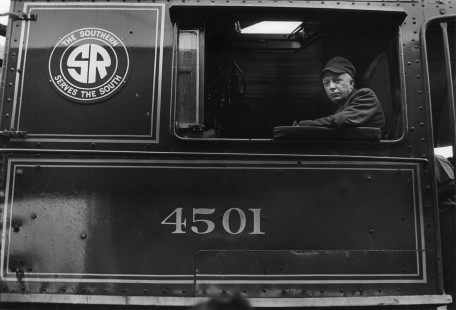 Trains magazine editor David P. Morgan in the cab of Southern Railway steam locomotive no. 4501 in Salisbury, North Carolina, on August 26, 1966.
